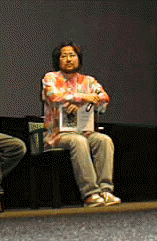 『Rocket』のキャラクターと志茂浩和氏。制作環境は、『Power Macintosh 9600/200』、『Indigo 2』、『Softimage 3D』など 。「この作品を、TVや映画にまで育てていきたい」と抱負を述べた