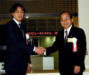 左からプライムシステム代表取締役社長の永田仁氏、TCS代表取締役社長の半沢保博氏