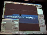 水上をホバリングして飛沫があがるシーンを3DCGアニメーションで描いている